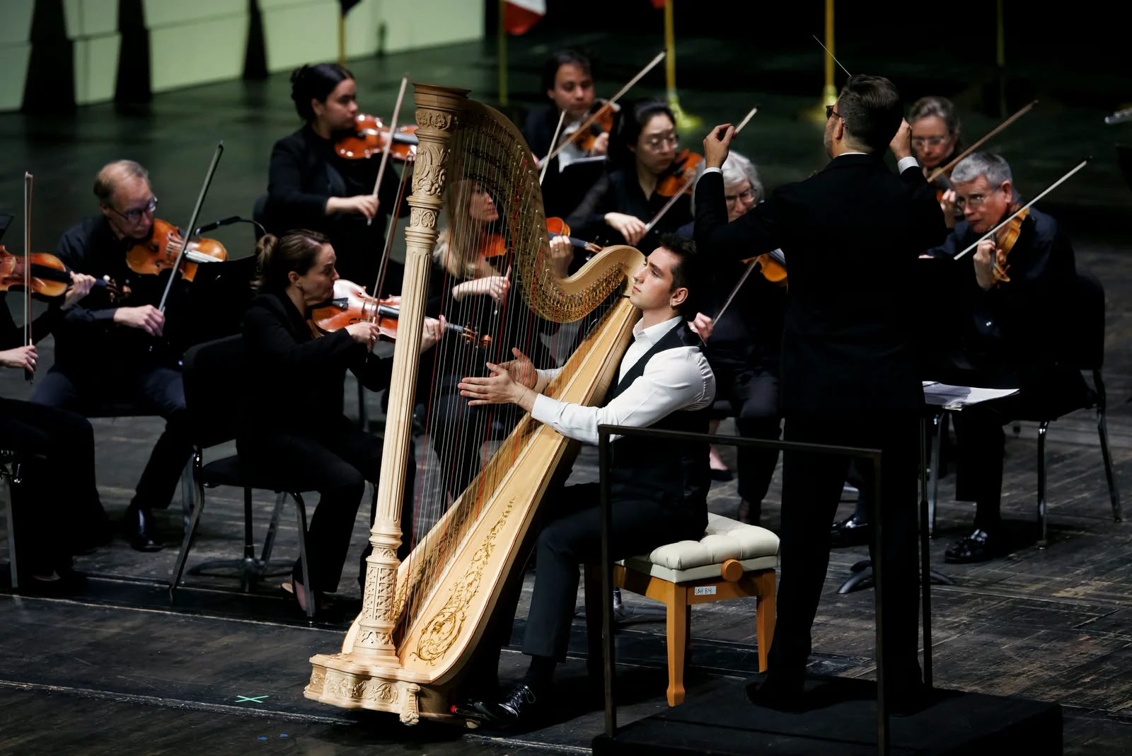 Huw Boucher performing as concerto soloist with orchestra.